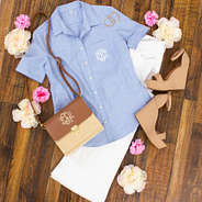 preppy outfit with monogrammed collared blue top and white flare jeans