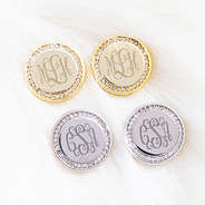 pave disc earrings on white fur