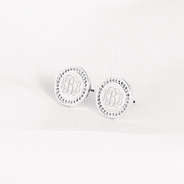 silver personalized disc earrings on cloth