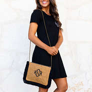 straw fringe crossbody bag over the shoulder with black dress