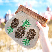 personalized pineapple clutch with hotel in background