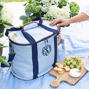 personalized cooler in navy seersucker on picnic blanket