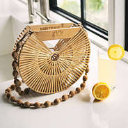 marleylilly monogrammed bamboo handbag on counter with lemonade