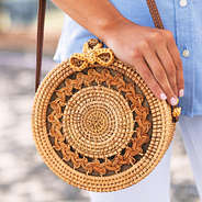 straw handbag with braided detailing and bow clasp