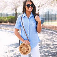 hard round straw shoulder bag with leather strap