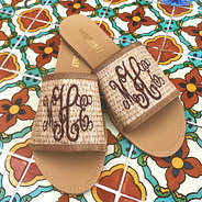 straw slide sandals on colorful tile floor