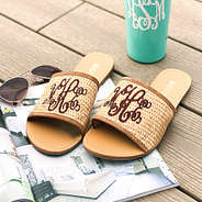 monogrammed straw slide sandals with magazine and sunglasses on dock