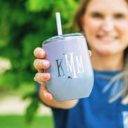 holding Monogrammed purple tie dye Wine Tumbler