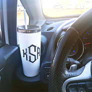 white monogrammed stainless steel cup in car