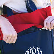 red and navy monogrammed tote with concealed zipper compartment