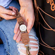 close up of monogram on brown duck boot lace lanyard