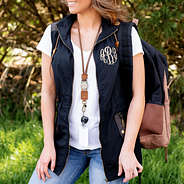 duck boot lace lanyard with monogrammed utility vest and bookbag outside