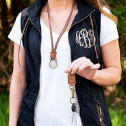 monogrammed black utility vest and separated duck boot lace lanyard outside