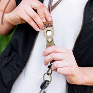 unclipping the monogrammed duck boot lace lanyard