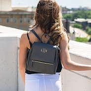 girl on rooftop wearing monogrammed mini charcoal backpack