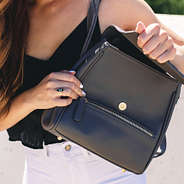 mini backpack with front zipper pocket and foldover flap