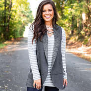 reversible gray vest with sherpa side paired with gray and white striped two way tunic