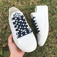 navy star shoe laces on monogrammed knit sneakers