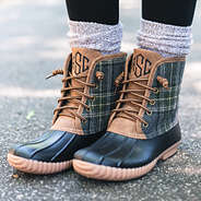 charcoal plaid and black monogrammed duck boots with leggings and duck boot socks on pavement