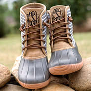 monogrammed gray duck boots on rocks