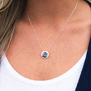 sterling silver monogrammed nala necklace around girl's neck