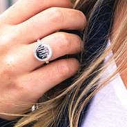 monogrammed nala sterling silver ring on girl's hand
