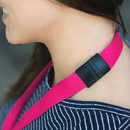 hot pink lanyard with breakaway clasp around neck
