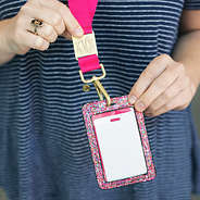 monogrammed hot pink and confetti breakaway lanyard around neck