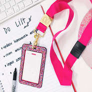 hot pink monogrammed breakaway lanyard with confetti card case laying on desk with to-do list
