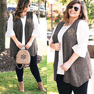 plus size model in monogrammed knit vest with bell sleeve top