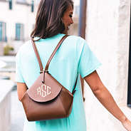 monogrammed convertible mini backpack on girl's back