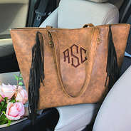 monogrammed fringe tote in the car