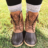 brown duck boots with twirled brown laces