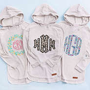 monogrammed terry hoodies in lemon, leopard, and colorful patterns