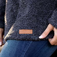 leather branding on sherpa pullover tunic