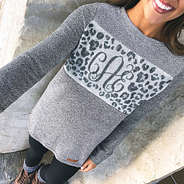 selfie of monogrammed leopard colorblock pullover