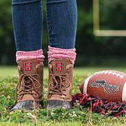 nc state duck boots in brown on football field