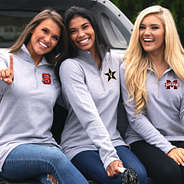 girls at football game tailgate wearing pullover sweatshirts