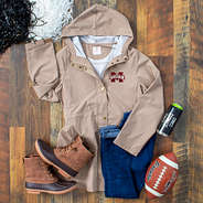 Mississippi State Khaki rain jacket with wood background