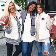 girls at tailgate in mississippi state gameday gear