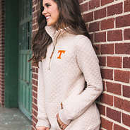 tennessee quilted pullover sweatshirt against brick wall