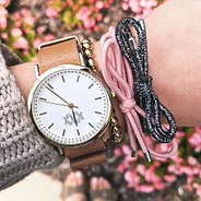 bow tie hair bands on wrist with monogrammed watch