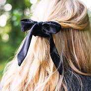 black velvet bow scrunchie in blonde hair