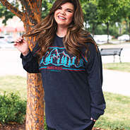 charcoal preppy mountain tee in front of trees