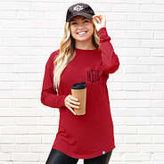 close up of crimson long sleeve pocket tee with baseball hat
