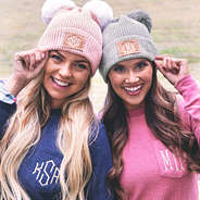 pink and grey monogrammed pom pom beanies