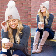 girl wearing monogrammed gray beanie and long sleeve shirt
