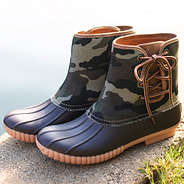 camo pull on duck boots near pond