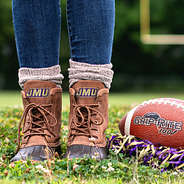 jmu brown duck boots on football field with poms and football