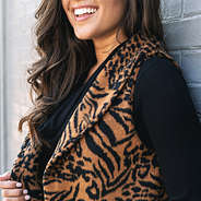 textured detail on tiger print fur vest